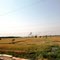 Seen from the Shiv Ganga train, black smoke from a brick factory.