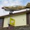 Landing Strip Inn on Eastern Boulevard with WWII Martins trainer aircraft on roof