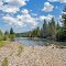 Viewing east-south-easterly, downstream, at the Clark's Fork Yellowstone River from alongside the Chief Joseph Highway (Wyo. State Hwy. 296), near Painter Outpost. Cody, Wyoming