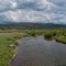 Tosi Creek flows across the meadows toward its confluence with the Green River