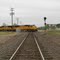 A Union Pacific train crosses the BNSF diamonds at Milano