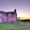 Abandoned house at sunset