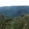 view up Kowmung River, Ruby Creek and Burnt Hole Creek valleys, cliffs of Loombah Walls in middle ground, then across Boyd Plateau, looking up Despond Creek valley towards Mount Misery