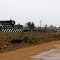 Mungo mailbox and a wet road