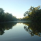 Sun rising on Normanby river near 9 mile camp
