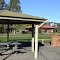 Barbecue and shelter with plaque to Raymond Bibby