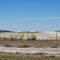 End of landing strip with refueling shed