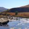 Zulu women washing clothes in a Drakensberg stream