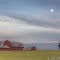 Moon Rises Over Farm on Moraine Crest