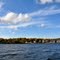 USA - VT - Lake Champlain. Crossing the lake part 5 of 9: blue sky over Essex in fall