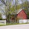 Red Barn with white fence