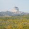 The Formidable Face Of Majestic Chief Mountain Towering Above Autumn Hills Of Gold North of St Mary, Montana Sep '12
