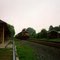 Westbound Norfolk Southern Railway Freight Train led by Locomotive No. 9242 passes the former Reading Railroad Station at Palmyra, PA
