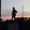 World War I bronze soldier against sunset, Olathe Memorial Cemetary, Olathe, KS