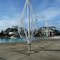 skeletal frames of pool umbrellas await spring in the dormant swimming pool area on a gusty winter day, 1-12-12