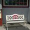 Old Coca-Cola machine and bench