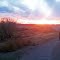 My Dad walking the dog in the dogpark with "Rick-not in picture", Sunsetting behind the rockies
