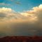 Red Hills and dark clouds on Hwy 395, California