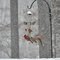 Birds gang up on feeder during winter snow storm