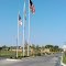 Flags fly at entrance to city