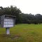 USPS Mailbox in an empty field, unlocked and not used.  August 2013