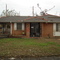 Grandparents house Post-Katrina.  Notice the garden timbers that floated and finally rested on top the house!