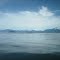 The Sukoi Islets in Frederick Sound as seen from the entrance to Wrangell Narrows at Petersburg. The 3,000 to 5,000 foot peaks in the distance surround Thomas Bay and the Baird Glacier. July 15, 2012