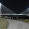 Bob Kerrey Pedestrian Bridge Spanning the Missouri River between Downtown Omaha, NE (on the left) and Council Bluffs, IA (on the right).  Unfortunately the LED Lights at the Top of the Pillars stopped working within a Year of Construction.
