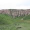 Rock Outcrop with Poppies blooming below