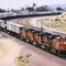 An eastbound train enters Barstow Yard from the west