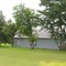 Barn quilt behind a tree