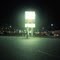 bright sign with dark kansan night