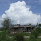 Thunderhead over Katrina damaged home.