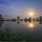 Moon Setting over a Lake