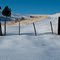 Snowed-in roadway to farm field