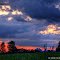 Grain Elevators Silhouetted In Red