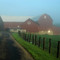 Farm in morning fog
