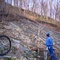 Biker beside Rockslide