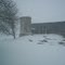 My barn and silo in a spring snow storm