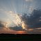 Sunrays bursting from clouds.