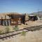 MW Speeder sheds. Made of ties covered with dirt. Roof is rail. Like a bunker.
