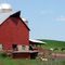 A Well Kept Barn And Fine Horses In The Pasture