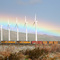 Desert rainbow as a train passes underneath