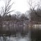 Snow covered steep riverbanks on Shiawassee River