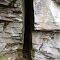 HUGE CRACK IN ROCK OUTCROPPING.