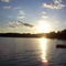 The sun sets over Norway Lake in the summertime.