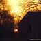 Sun Rising Behind Barn