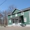 green house and esso sign