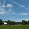 Contrail and a barn