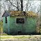 Old moss covered building at railroad siding, Factoryville, PA.